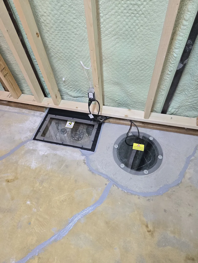 Sealed sub-slab suction points of a Sask Air radon system