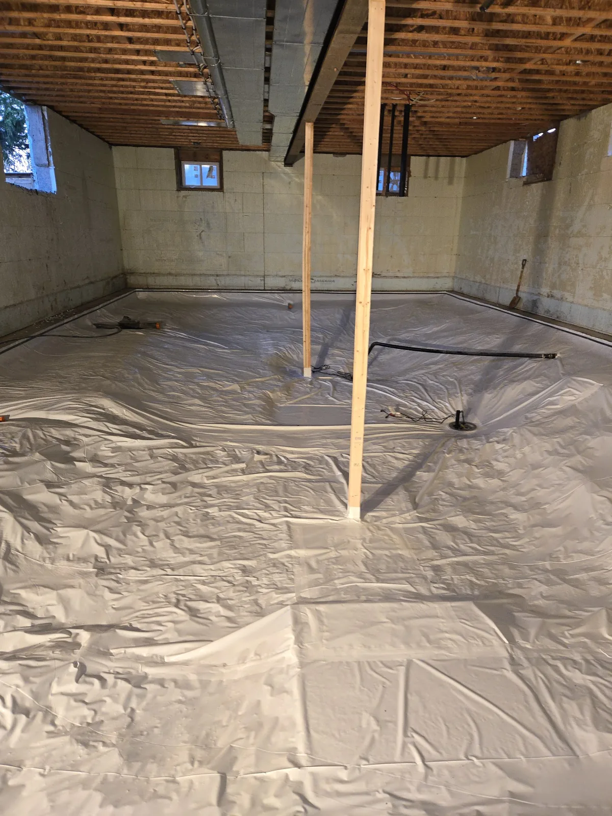 A sealed crawl-space encapsulation membrane installed by Sask Air Solutions
