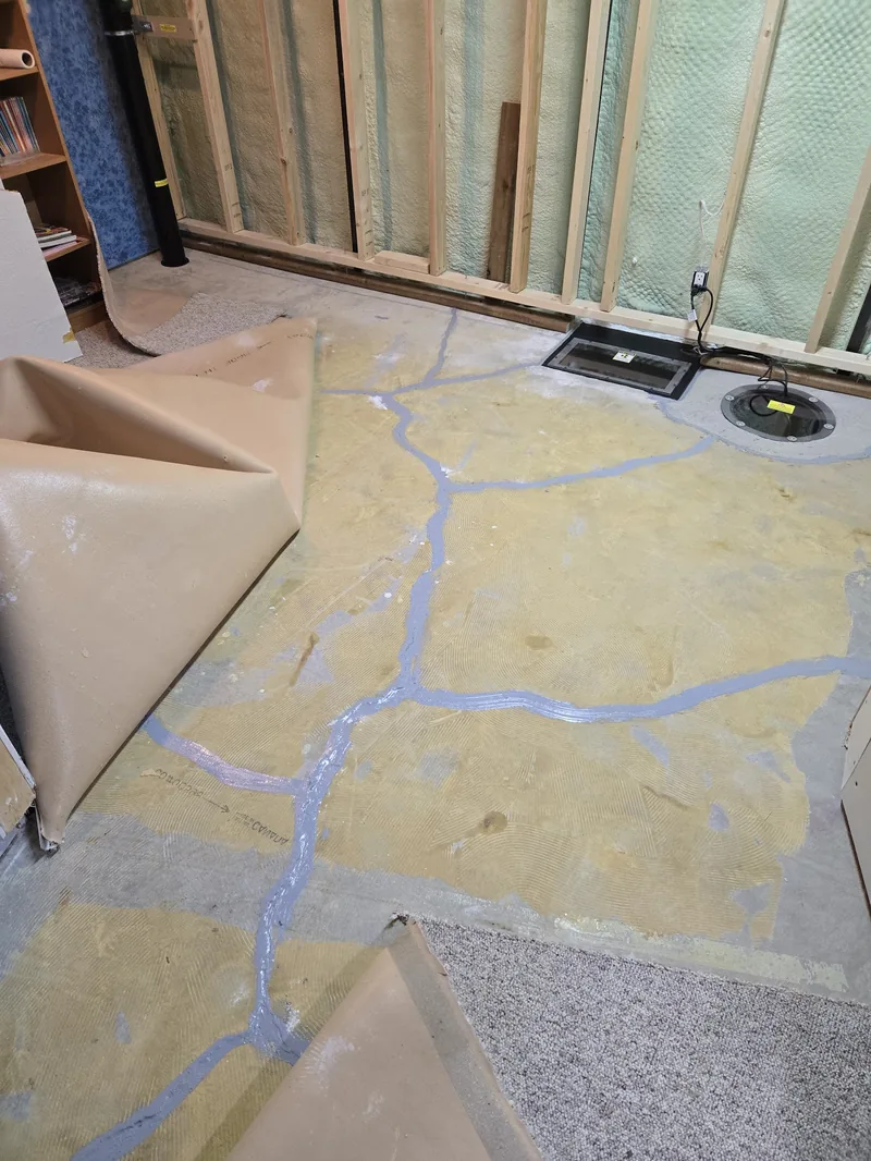 A radon mitigation system install in progress in a Regina home